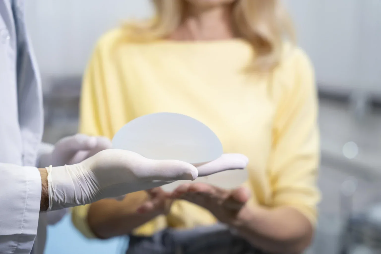 Breast implant held before placement